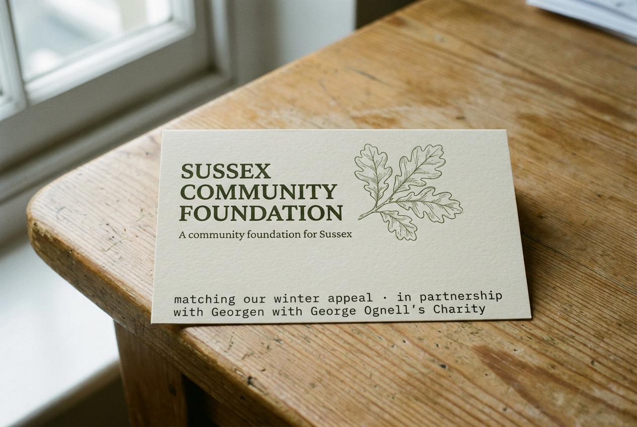 Sussex Community Foundation logo, printed on a green paper card.